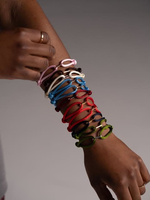 Stacked ONE bracelets on a wrist